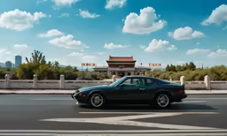 a black sports car is driving down the street