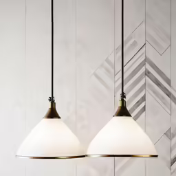 the two lights are in the room near a wall