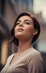 a woman standing outside with a building in the background