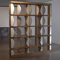 a brass shelf with glass doors on it