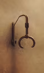 a hook is attached to the wall with two large nails