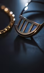 a gold comb with some small circles near it