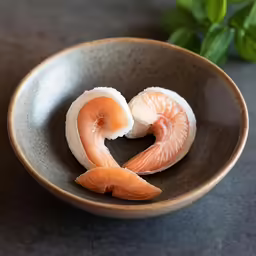 there is a small bowl with fish in it