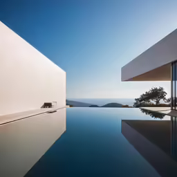 a view looking at the water and landscape from an outside pool