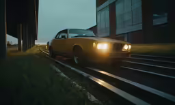 a car is riding down the train tracks