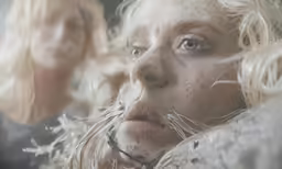 a very dirty blonde girl with freckled hair on her head
