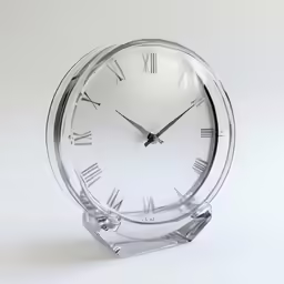 a silver clock that is sitting on top of a table