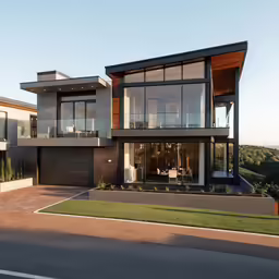 modern home with wooden and glass windows overlooking landscape