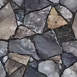 a stone wall with many different colors and shapes