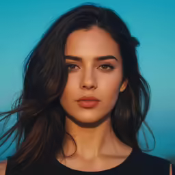 a young woman with long hair and dark eyes wearing a black top