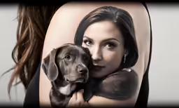 a woman with tattoos on her body holding her dog