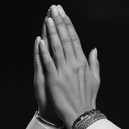 black and white photograph of a woman hands with jewelry