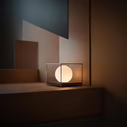 there is a small round light next to some steps