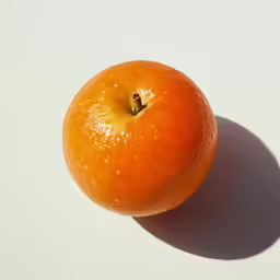 an orange that is on top of a table