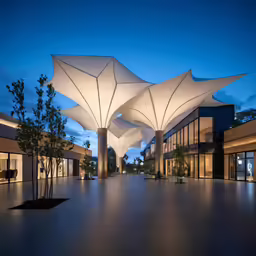 the front entrance of a modern architecture building at dusk