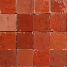 a red brick wall made up of orange and brown squares