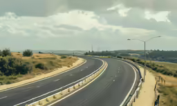 an empty, empty highway with a wind indicator