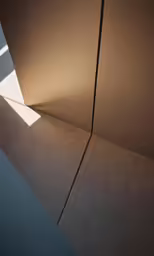 a very long metal pole near some concrete