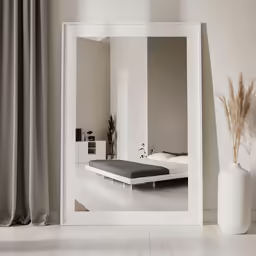 a bedroom with a large mirror in the center of it