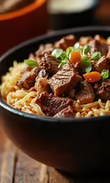 the meal has beef and rice in the bowl