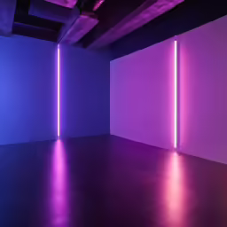 an empty room with bright lighting in the ceiling