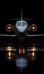 a black and white plane on a dark ground