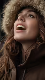 the woman is wearing a brown winter coat