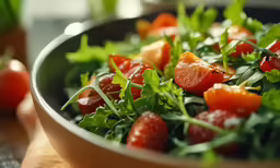 the fresh salad is loaded with tomatoes and lettuce