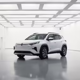 the new dacia suv is displayed in an empty room