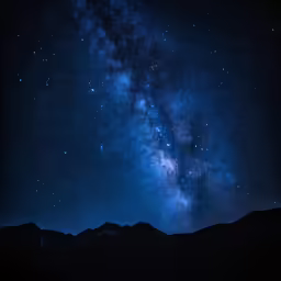 a night time scene with a lot of stars and the milky