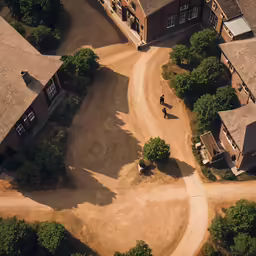 a aerial view of a man running on dirt