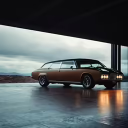 a tan station wagon parked on concrete under a cloudy sky
