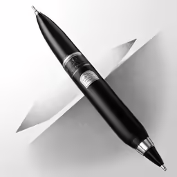 a black ball point pen with a sharp tip on it