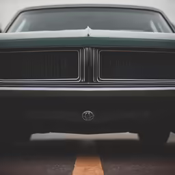 close up on an older car on the road