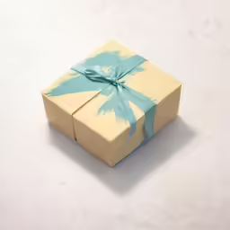 there is a small yellow gift box with a blue ribbon