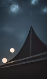 a view of a light in the sky from below