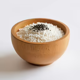 a bowl with rice is shown on the table