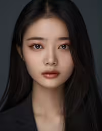 a close up photo of a person wearing a suit,an asian woman with long dark hair, a dark shirt and a black blazer