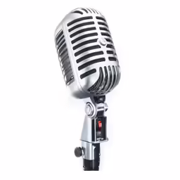 a silver microphone is against a white background