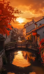 a bridge that crosses a small river near the buildings