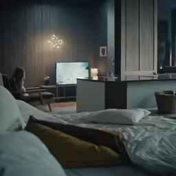 an image of a bedroom setting with bedding on the floor