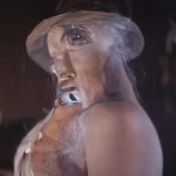 the reflection of a woman with white hair wearing a hat and a mask