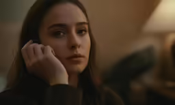 a woman holding a cell phone to her ear