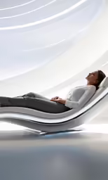 a woman is lying in an acupress chair