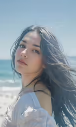 an image of a woman standing on the beach