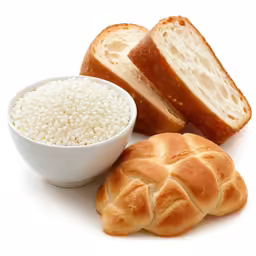 two loaves, one bun and one bagel next to bread