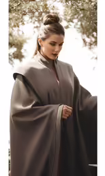 a beautiful woman with a long, slender hair and a gray cape