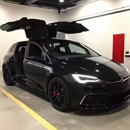 a black car with the hood up and the boot area opened