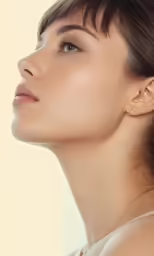 a woman has her face tilted slightly in half
