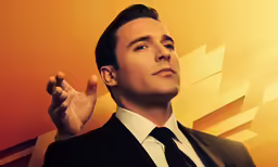 a man is wearing a suit and tie